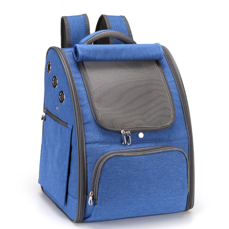 Blue dog backpack carrier showing a happy cat sticking out its tongue